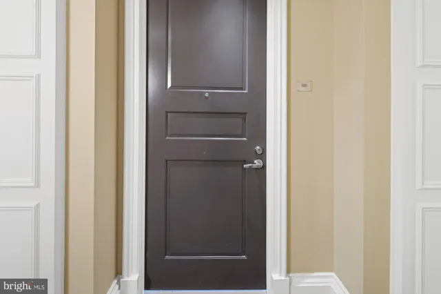 a kitchen with granite countertop a sink a stove and cabinets