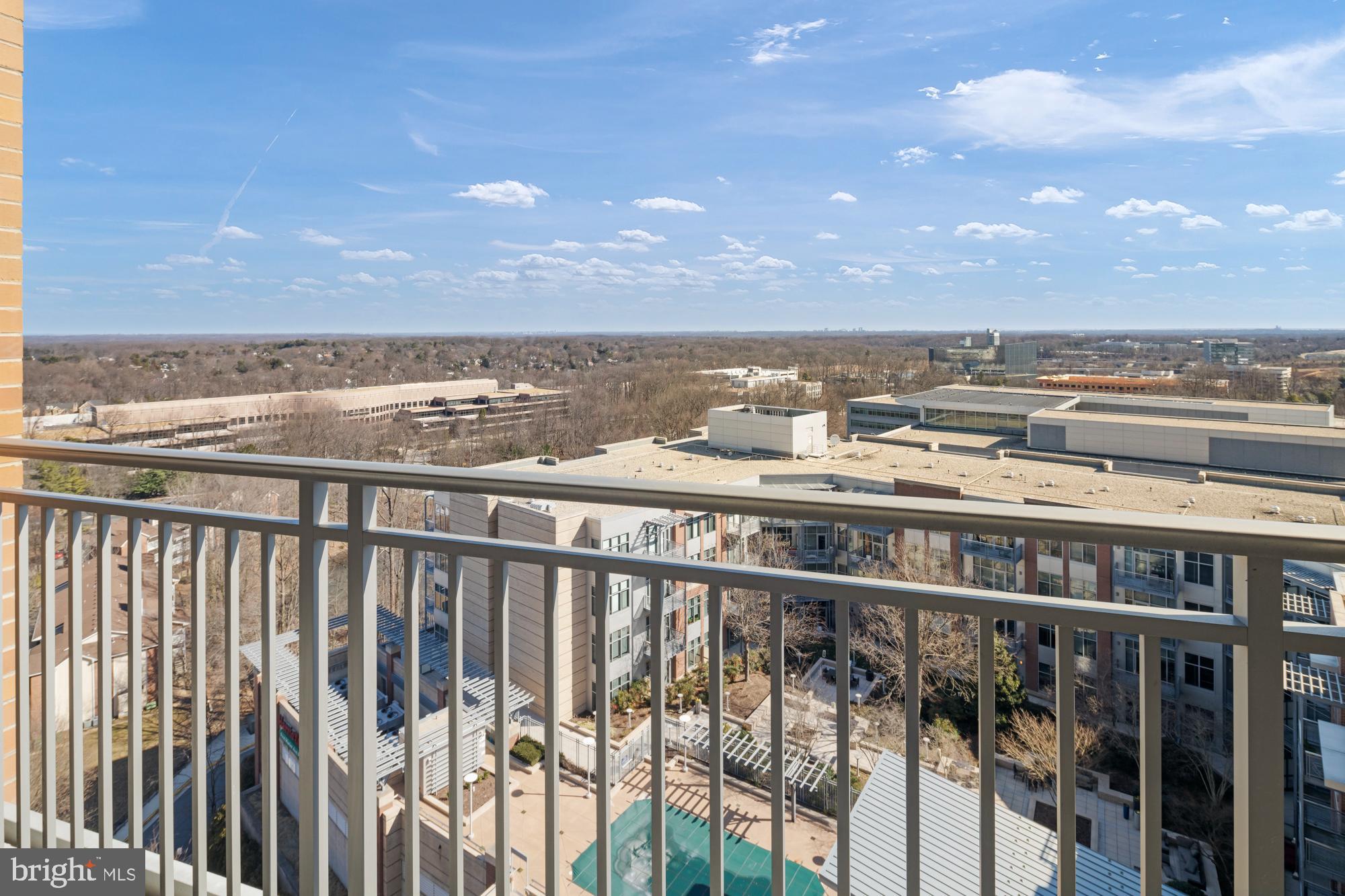 8220 Crestwood Heights Drive, Unit 1215 McLean, VA 22102 - Photo 32 of 59 Scenic balcony view over urban landscape.