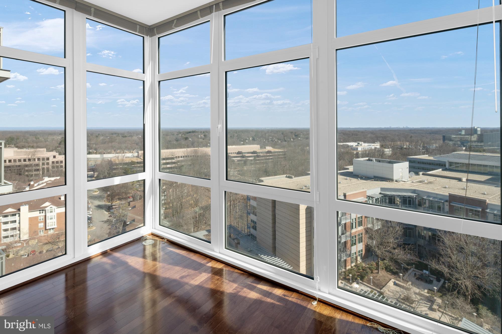 8220 Crestwood Heights Drive, Unit 1215 McLean, VA 22102 - Photo 33 of 59 a view of an empty room with wooden floor and windows