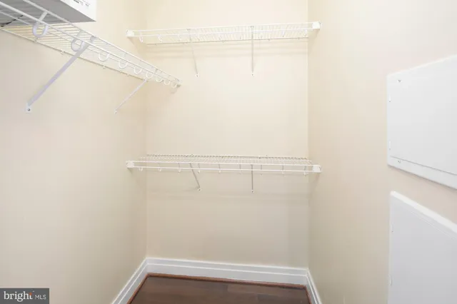 a living room with furniture and large windows