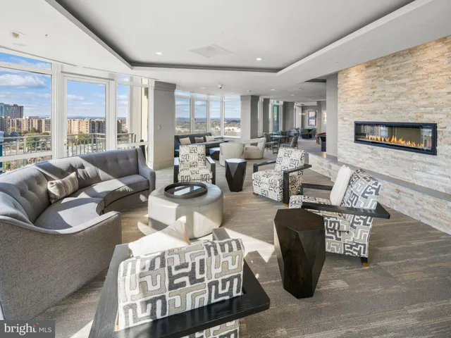 a room with pool table and windows
