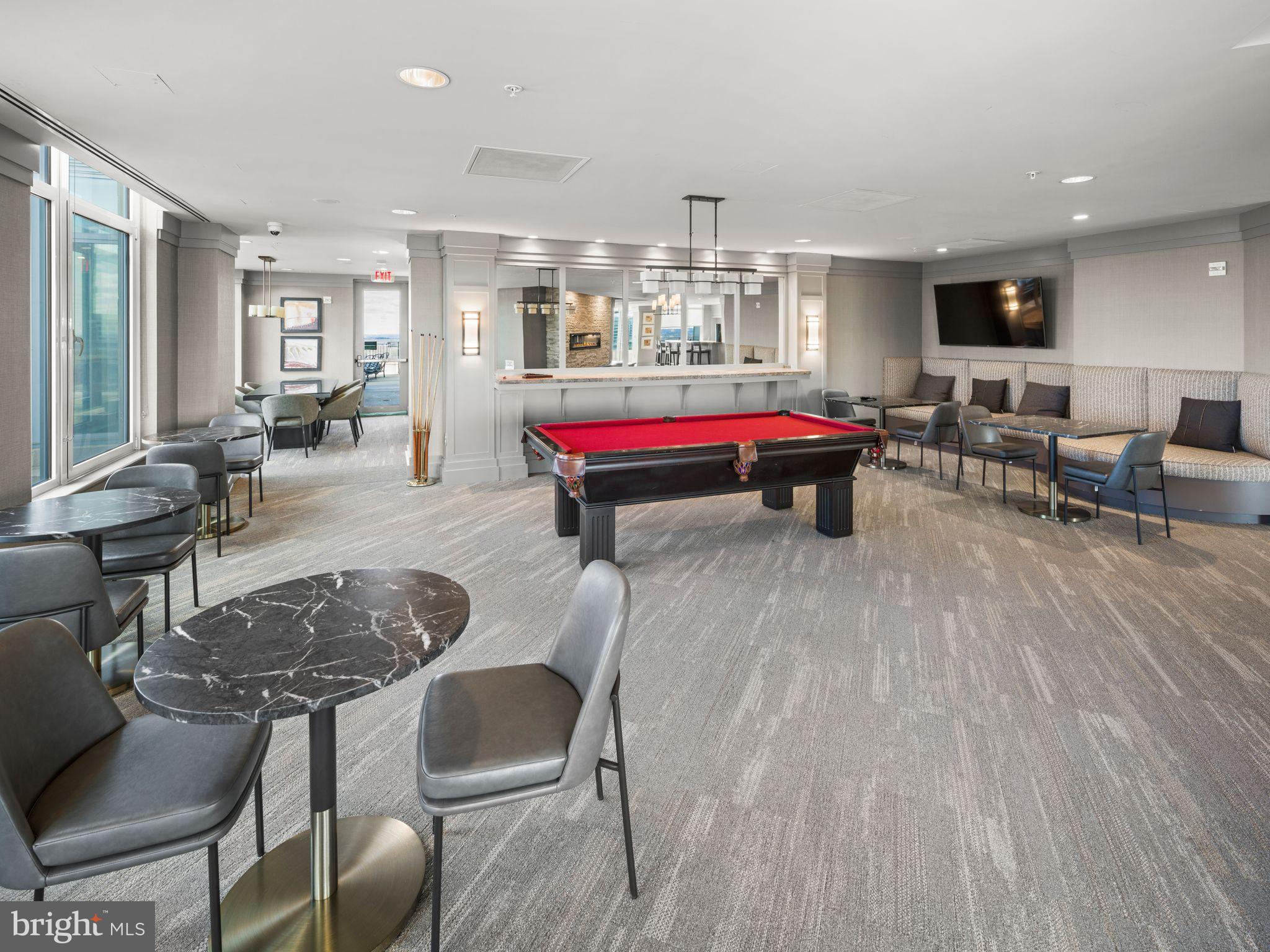 8220 Crestwood Heights Drive, Unit 1215 McLean, VA 22102 - Photo 42 of 59 Modern lounge with billiards and sleek design.