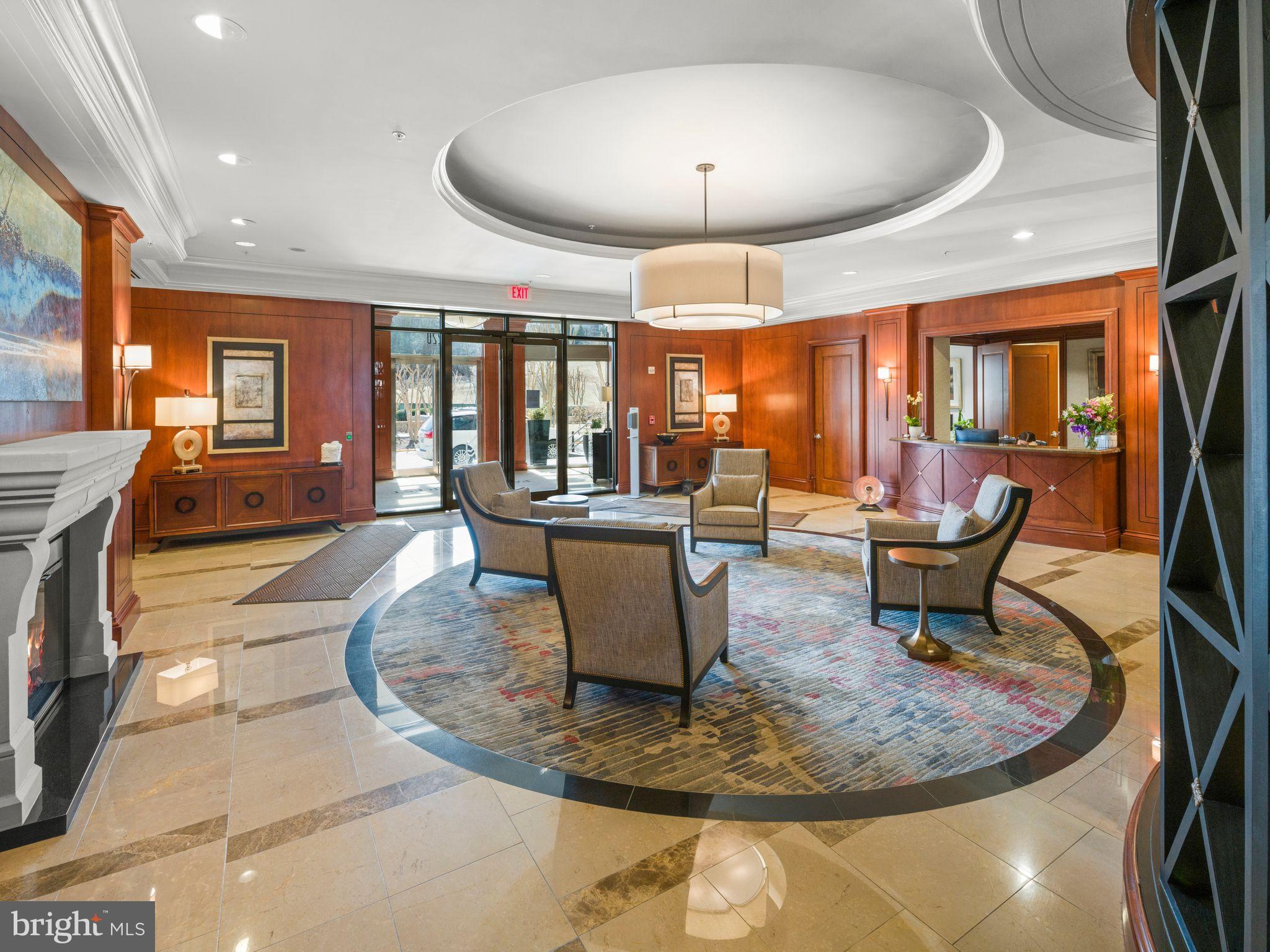 8220 Crestwood Heights Drive, Unit 1215 McLean, VA 22102 - Photo 57 of 59 a living room with furniture and a chandelier