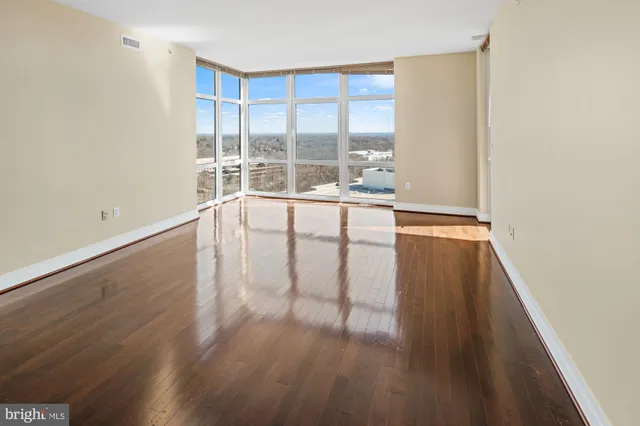 a view of a kitchen with wooden floor