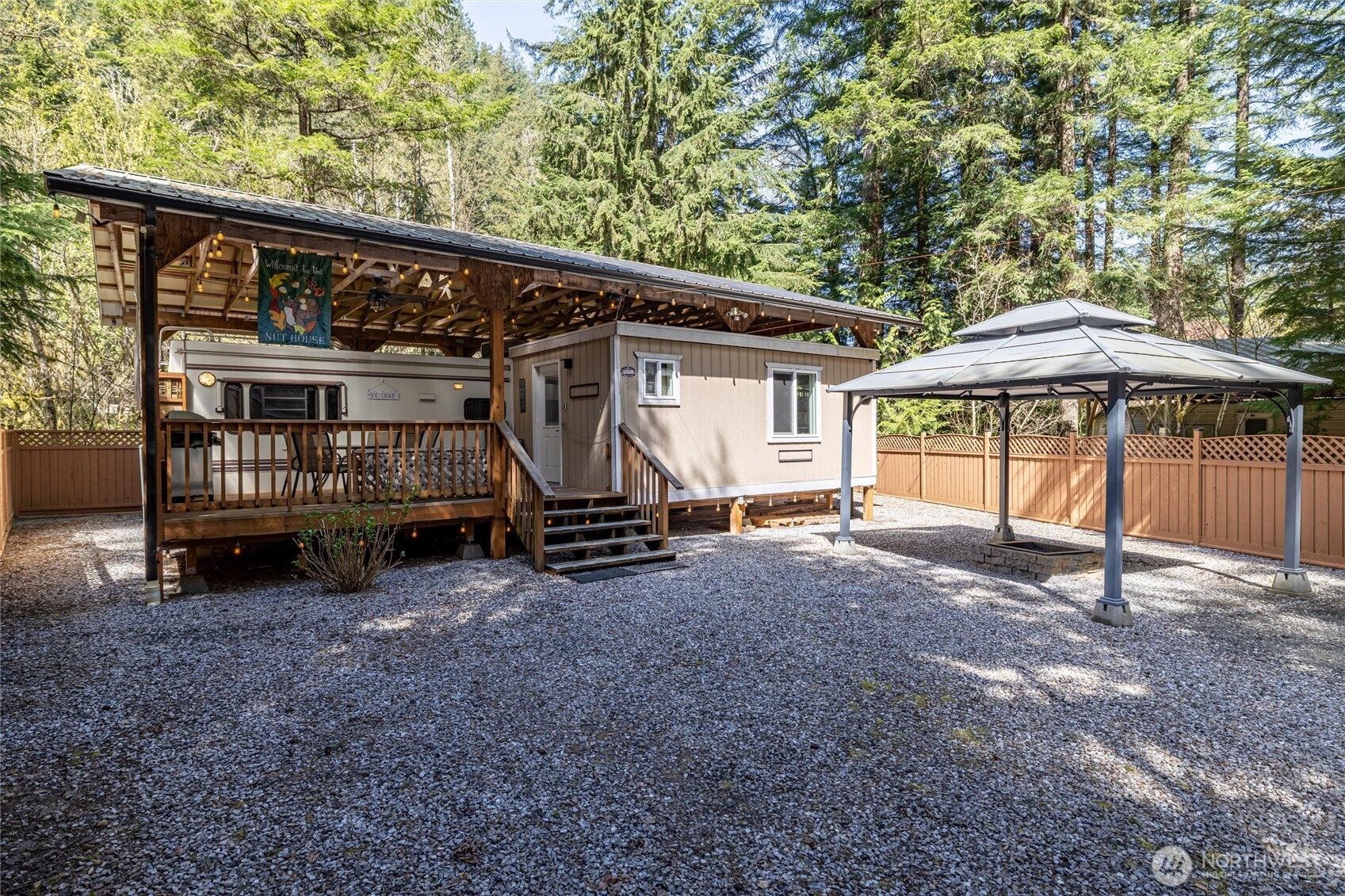 a view of a house with a yard and sitting area