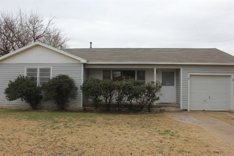 4407 37th Street Lubbock, TX 79414 - Photo 1 of 10 front view of house with potted plants
