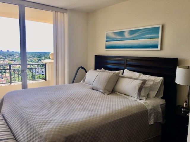 3232 Southwest 22nd Terrace, Unit 1303 Miami, FL 33145 - Photo 8 of 43 a bedroom with a bed and window