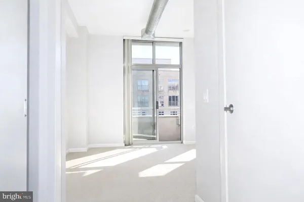 a view of a room that has a window in it