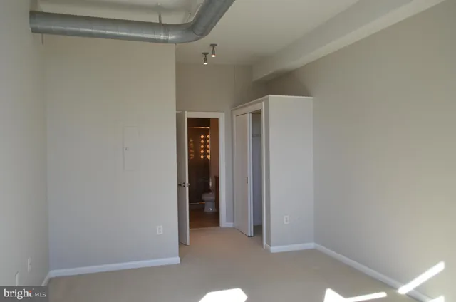 a view of hallway with closet