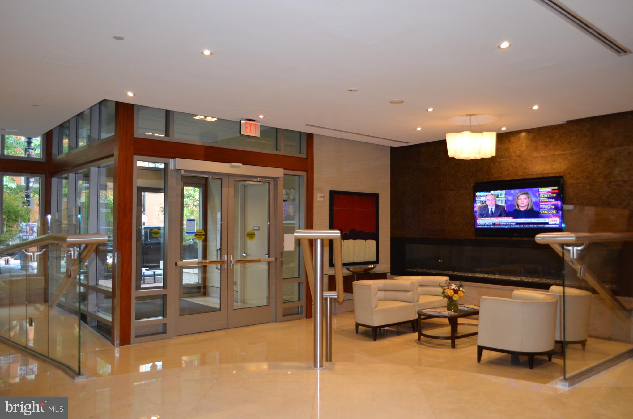 811 4th Street Northwest, Unit 1019 Washington, DC 20001 - Photo 3 of 38 a living room with furniture and a flat screen tv