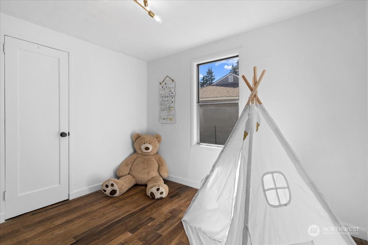 3304 Southeast 6th Street Renton, WA 98058 - Photo 13 of 30 a room with wooden floor and fan