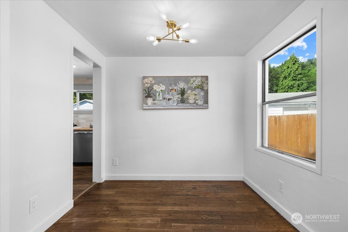 3304 Southeast 6th Street Renton, WA 98058 - Photo 14 of 30 wooden floor in an empty room with a window