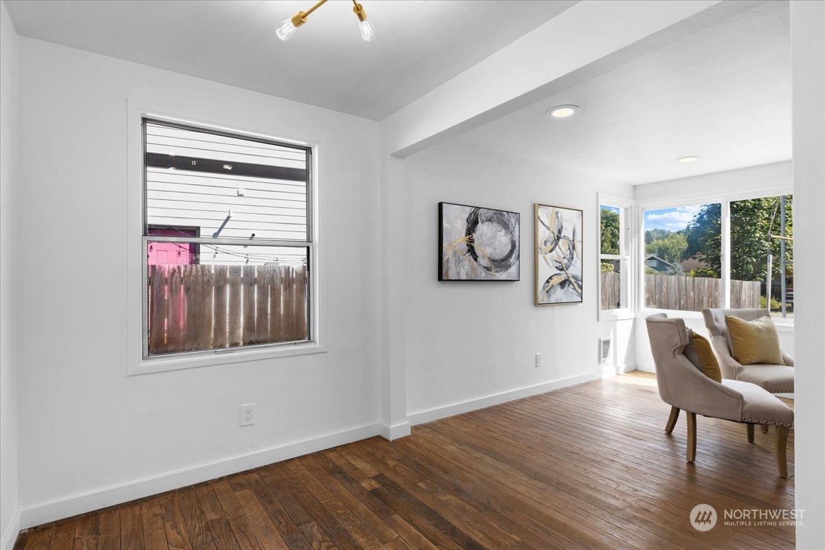 3304 Southeast 6th Street Renton, WA 98058 - Photo 15 of 30 a workspace room with wooden floor and windows