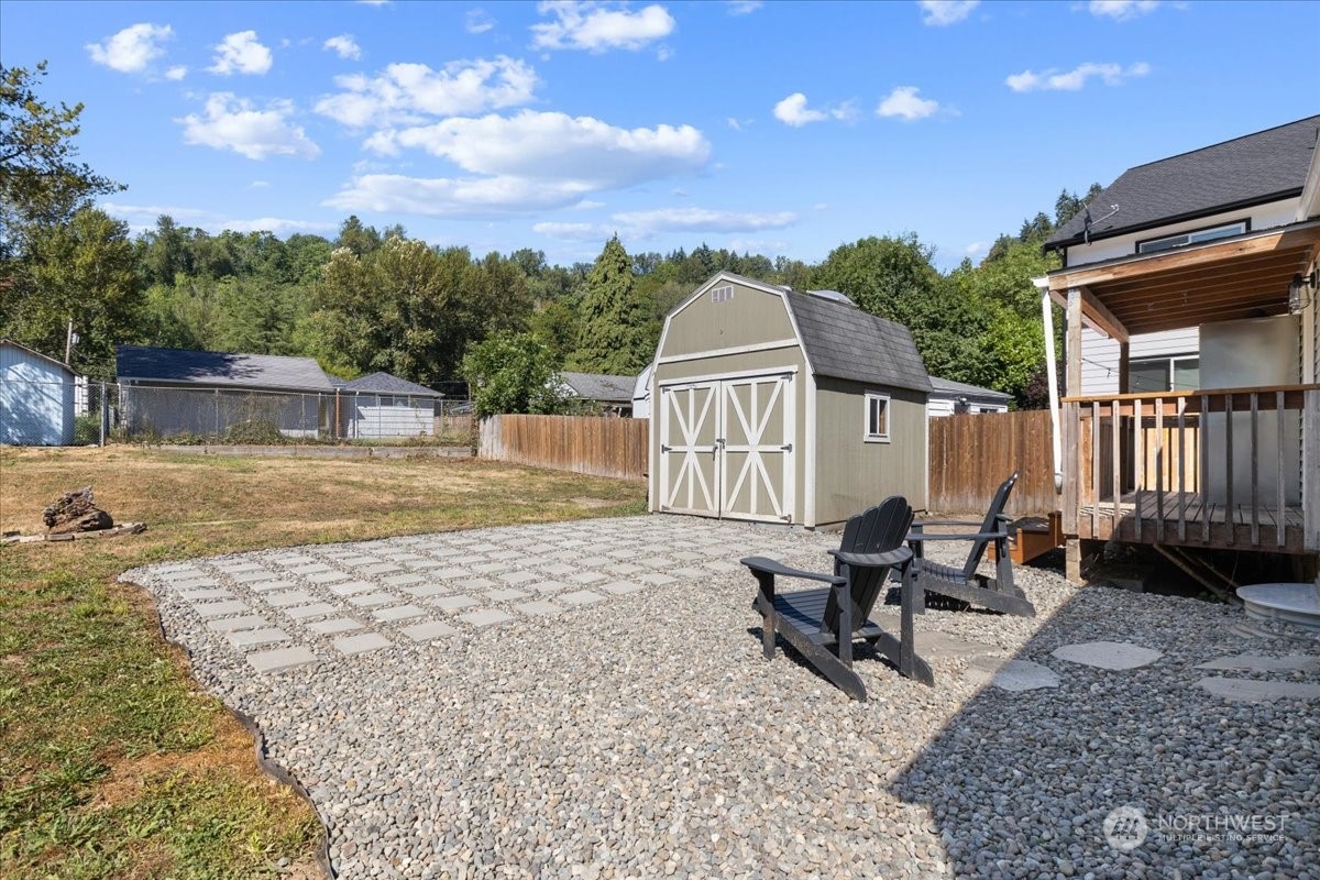 3304 Southeast 6th Street Renton, WA 98058 - Photo 22 of 30 a view of a house with backyard and sitting area
