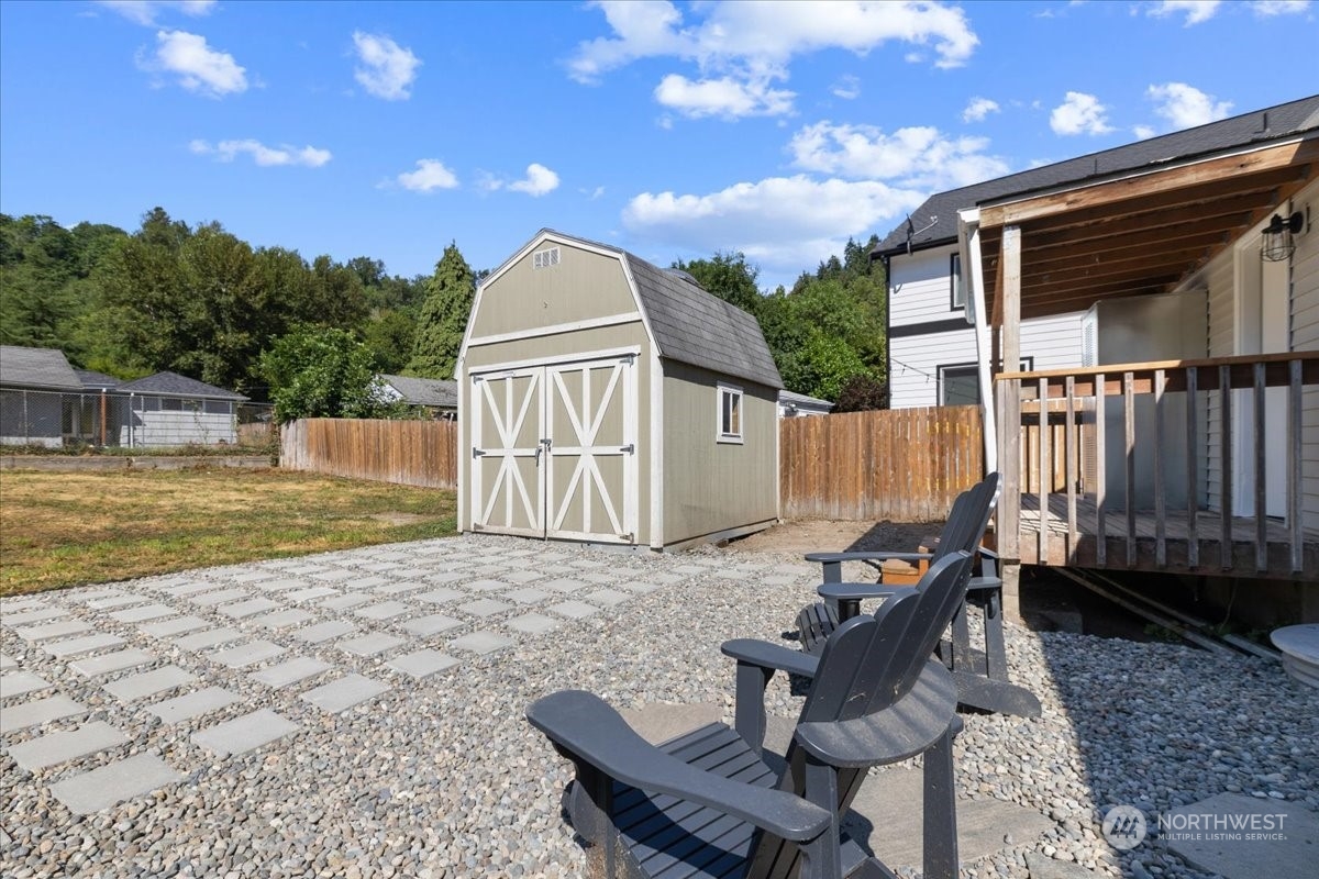 3304 Southeast 6th Street Renton, WA 98058 - Photo 23 of 30 a view of a chair and table in the backyard