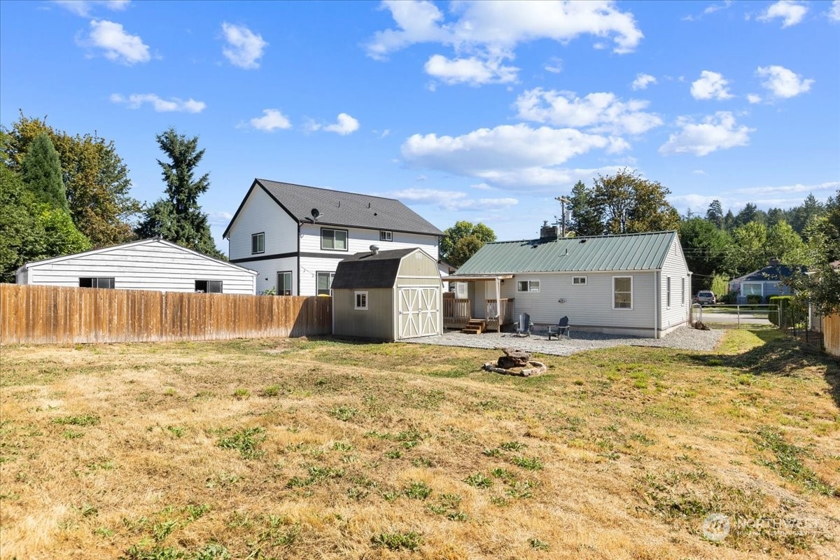3304 Southeast 6th Street Renton, WA 98058 - Photo 24 of 30 a big house with a big yard and large trees