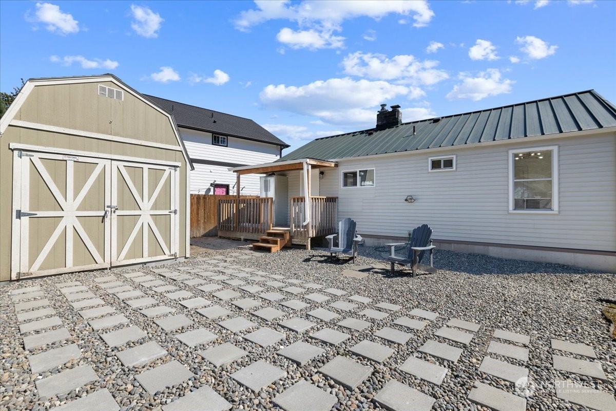 3304 Southeast 6th Street Renton, WA 98058 - Photo 26 of 30 a backyard of a house with yard and outdoor seating