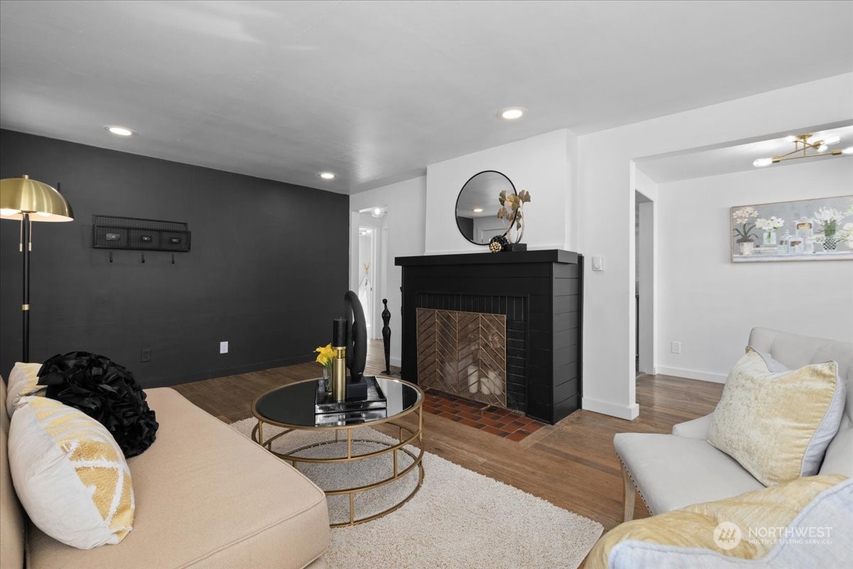 3304 Southeast 6th Street Renton, WA 98058 - Photo 7 of 30 a living room with furniture a table and a fireplace