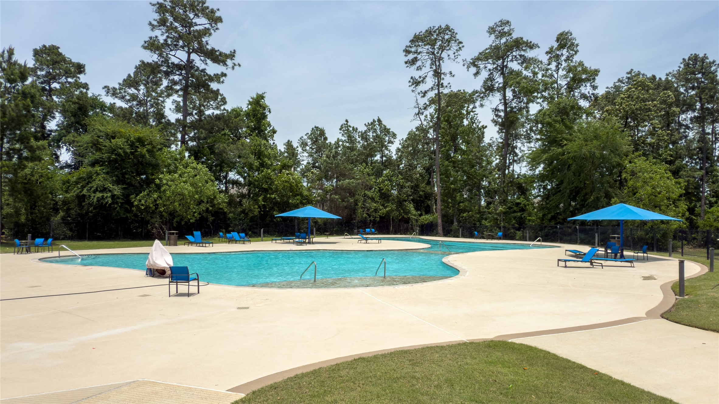 14108 Redfish Lake Conroe, TX 77384 - Photo 32 of 37 a swimming pool with outdoor seating and yard