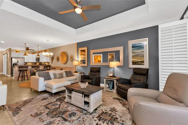 a living room with furniture wooden floor and a table
