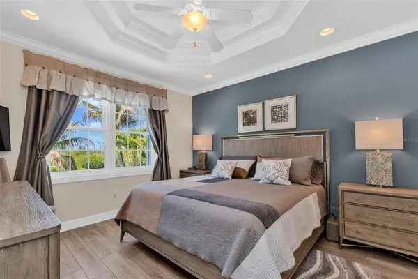 a bedroom with a large bed and a window