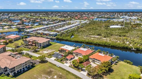 an aerial view of residential houses with outdoor space