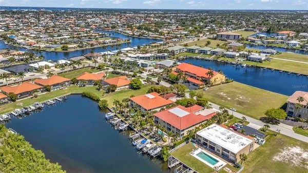 an aerial view of residential houses with outdoor space