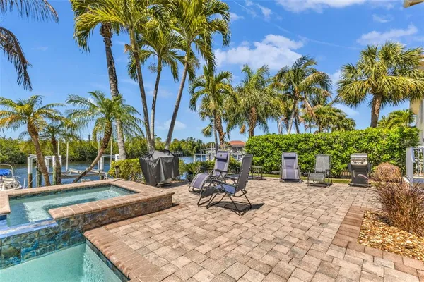 a view of a backyard with a patio