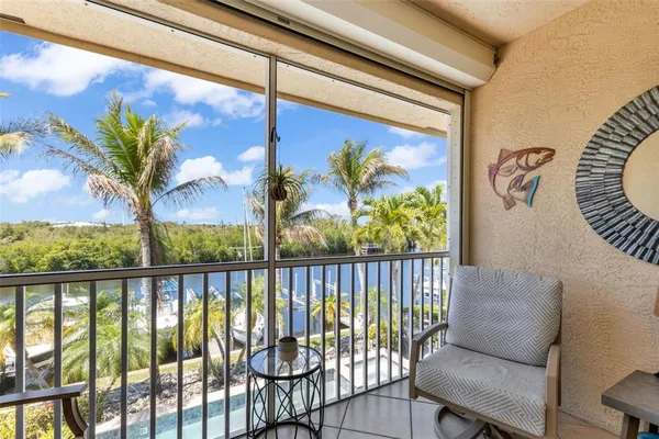 a view of a chair and table in a balcony