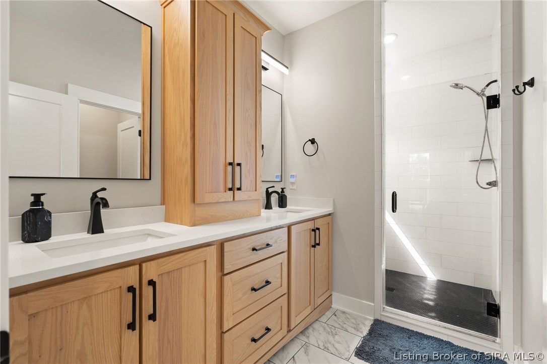 6019 Rising Fawn Court Georgetown, IN 47122 - Photo 7 of 50 Main bathroom - dual sinks, cabinetry, and walk-in shower!