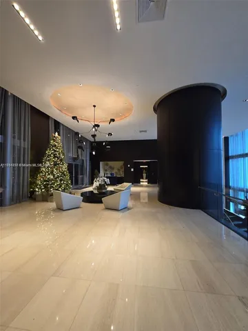 a view of a livingroom with furniture and a garage