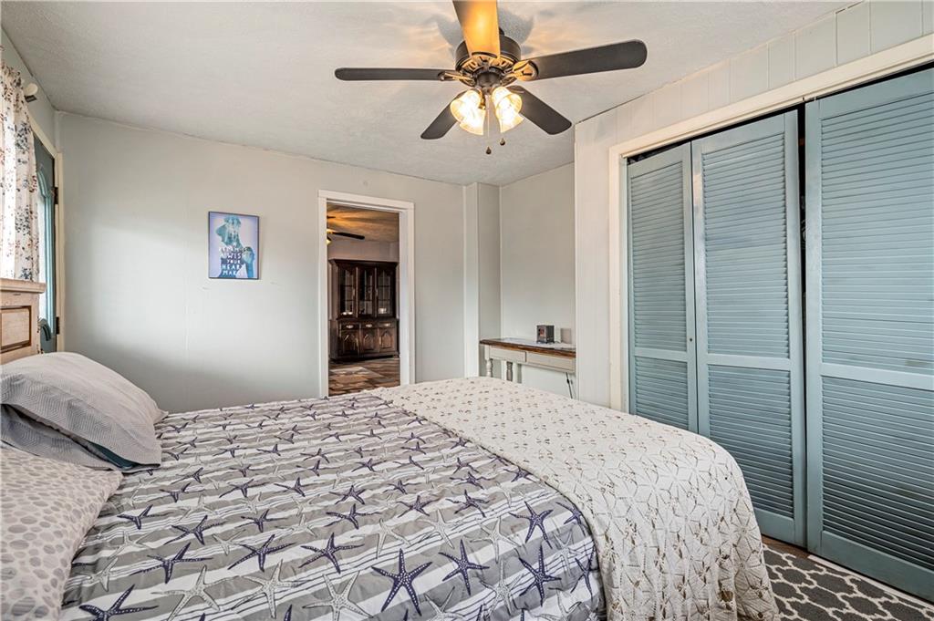 2099 Marshall Road Monaca, PA 15061 - Photo 11 of 24 a bedroom with a large bed and a chandelier