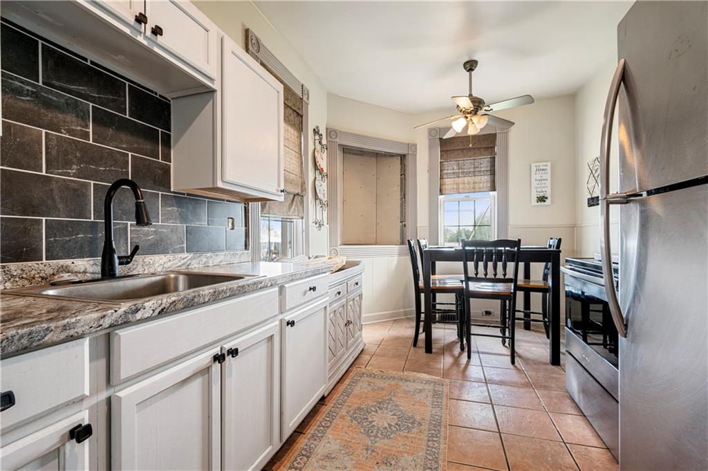 2099 Marshall Road Monaca, PA 15061 - Photo 7 of 24 a kitchen with stainless steel appliances granite countertop a sink stove and refrigerator
