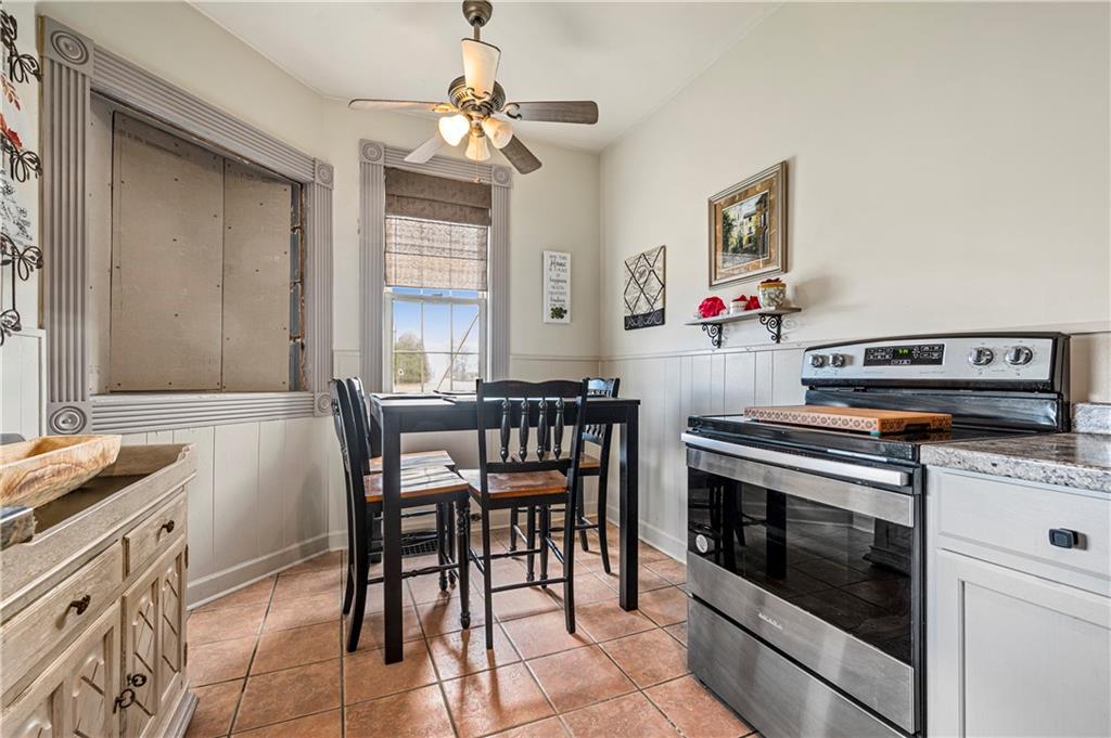 2099 Marshall Road Monaca, PA 15061 - Photo 8 of 24 a kitchen with granite countertop cabinets a stove and a dining table