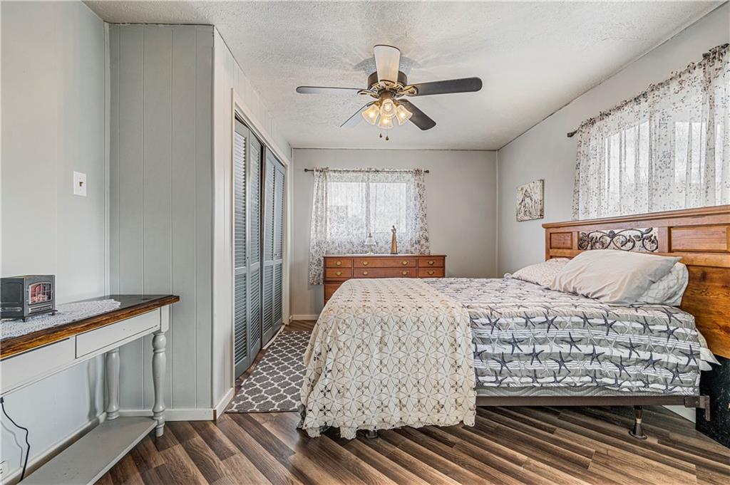 2099 Marshall Road Monaca, PA 15061 - Photo 10 of 24 a bedroom with a large bed and a chandelier