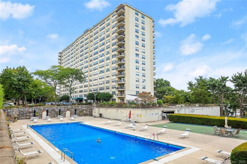 2625 Park Avenue, Unit 6M Bridgeport, CT 06604 - Photo 3 of 21 a view of a swimming pool with outdoor seating and plants