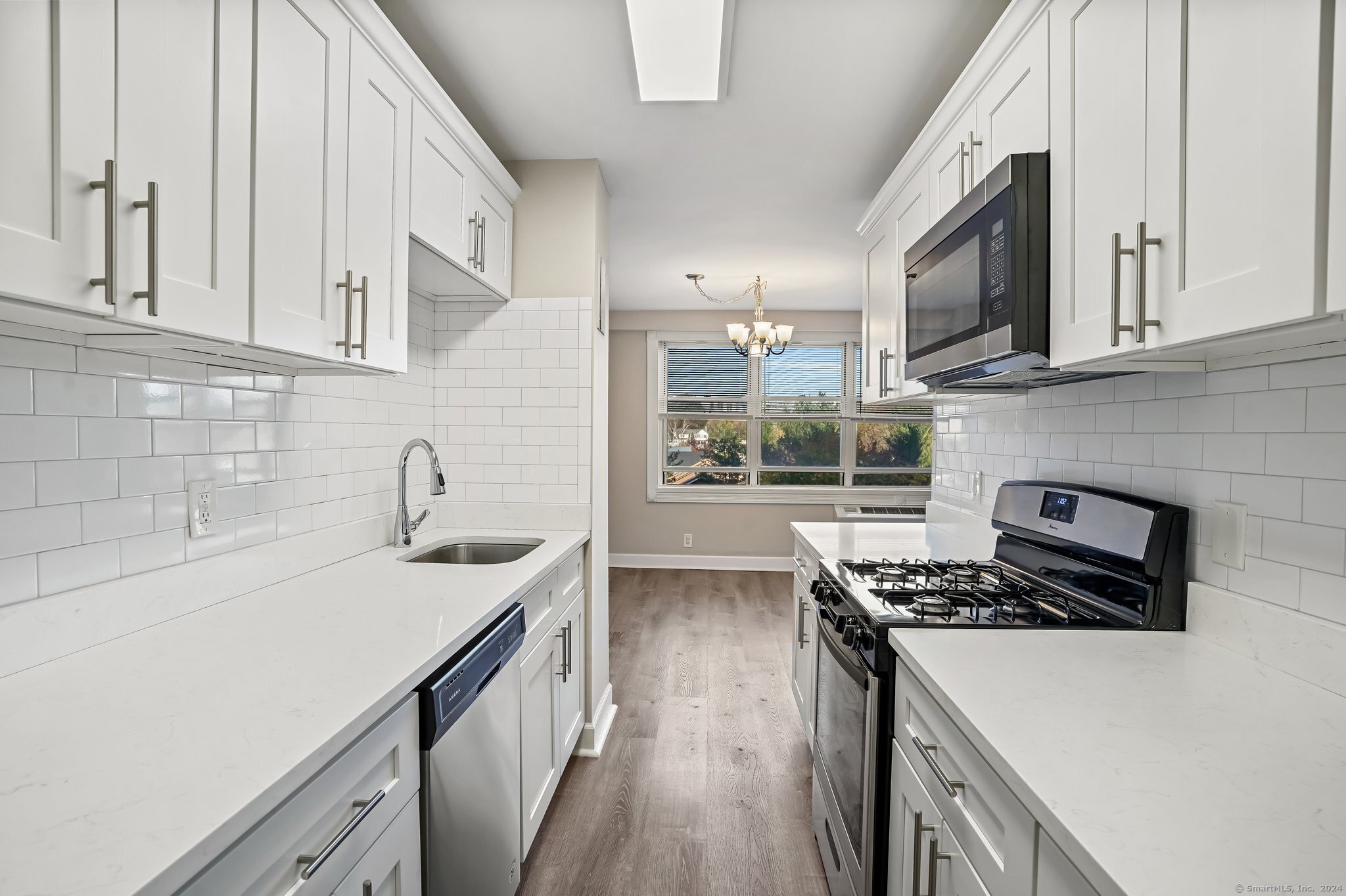 2625 Park Avenue, Unit 6M Bridgeport, CT 06604 - Photo 5 of 21 a kitchen with stainless steel appliances a sink stove and cabinets