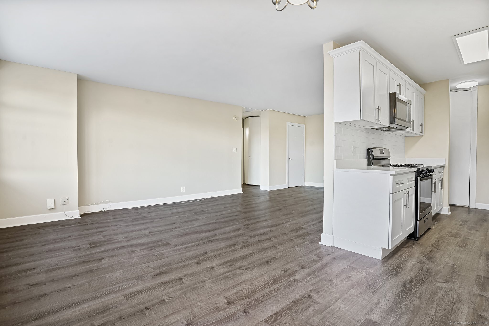 2625 Park Avenue, Unit 6M Bridgeport, CT 06604 - Photo 6 of 21 a view of a kitchen with wooden floor