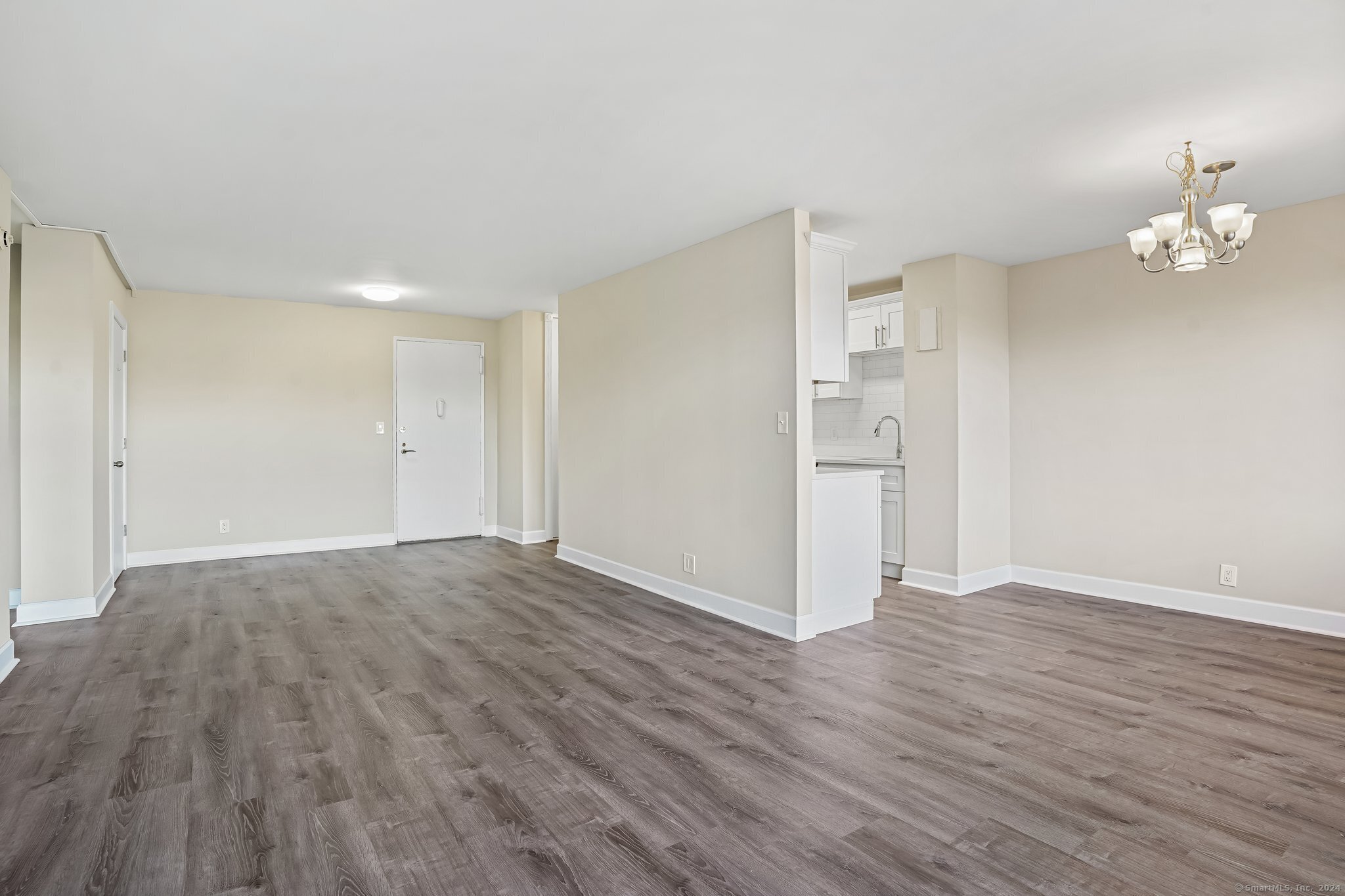 2625 Park Avenue, Unit 6M Bridgeport, CT 06604 - Photo 8 of 21 wooden floor in an empty room with a window