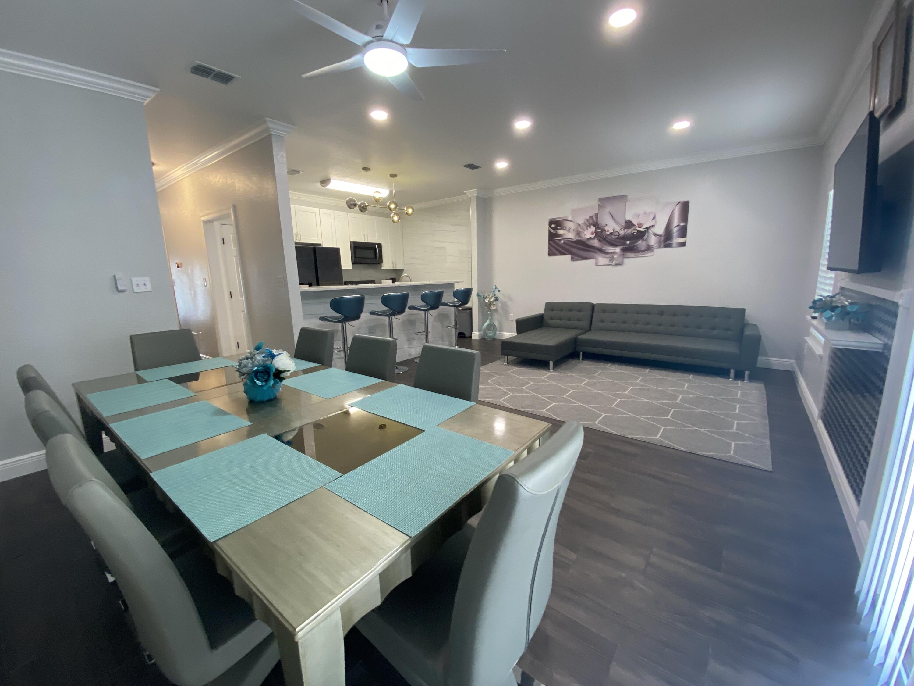1014 Airport Road, Unit 105 Destin, FL 32541 - Photo 9 of 12 a view of a dining room with furniture
