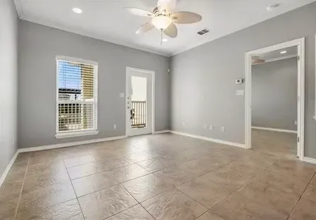 a view of an empty room with a window