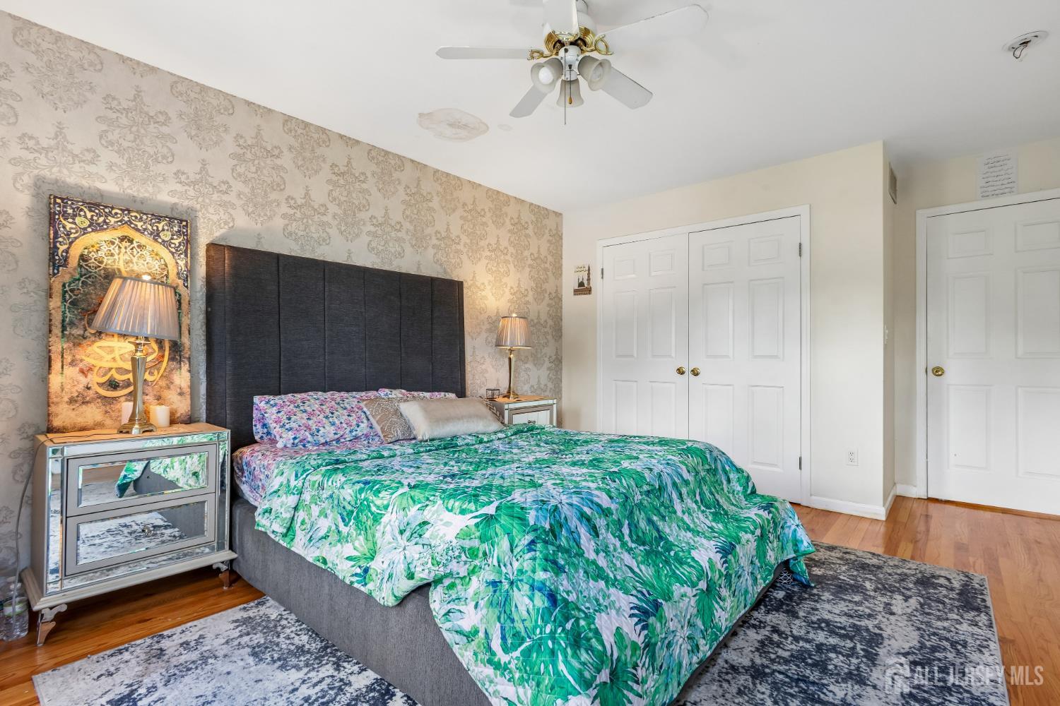489 Plainfield Road Edison, NJ 08820 - Photo 21 of 39 a bedroom with a bed and a flat tv screen on dresser