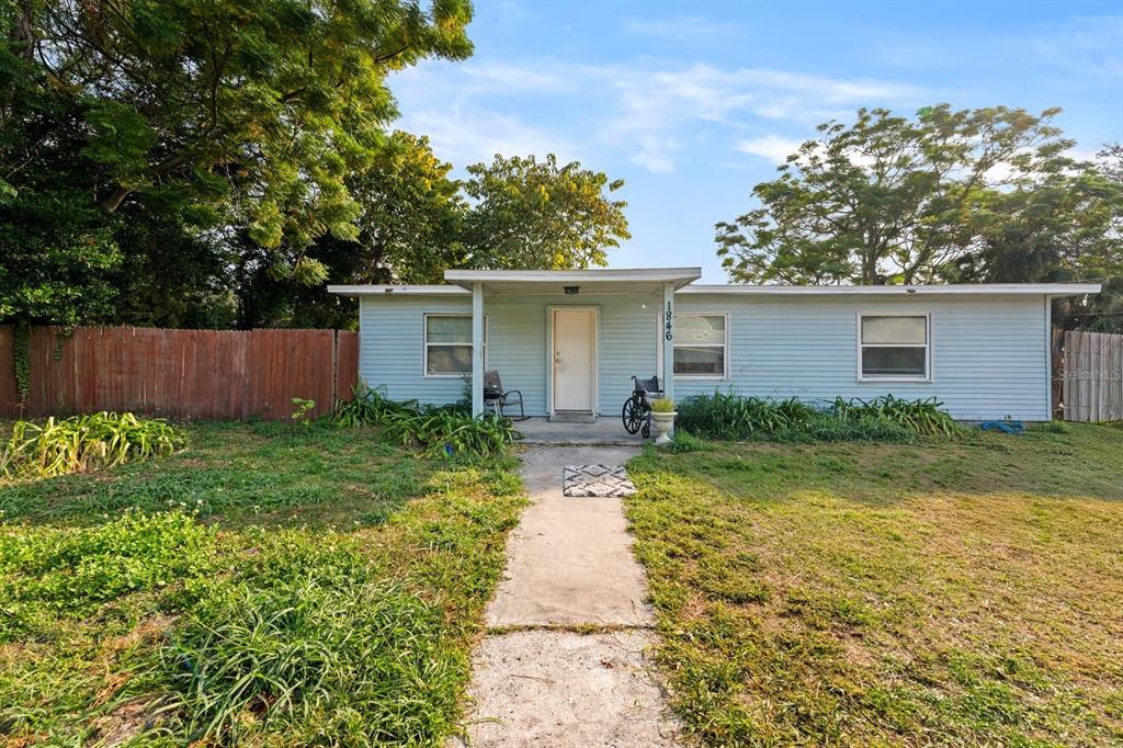 1846 Abacus Road Holiday, FL 34690 - Photo 1 of 20 a front view of house with yard and green space