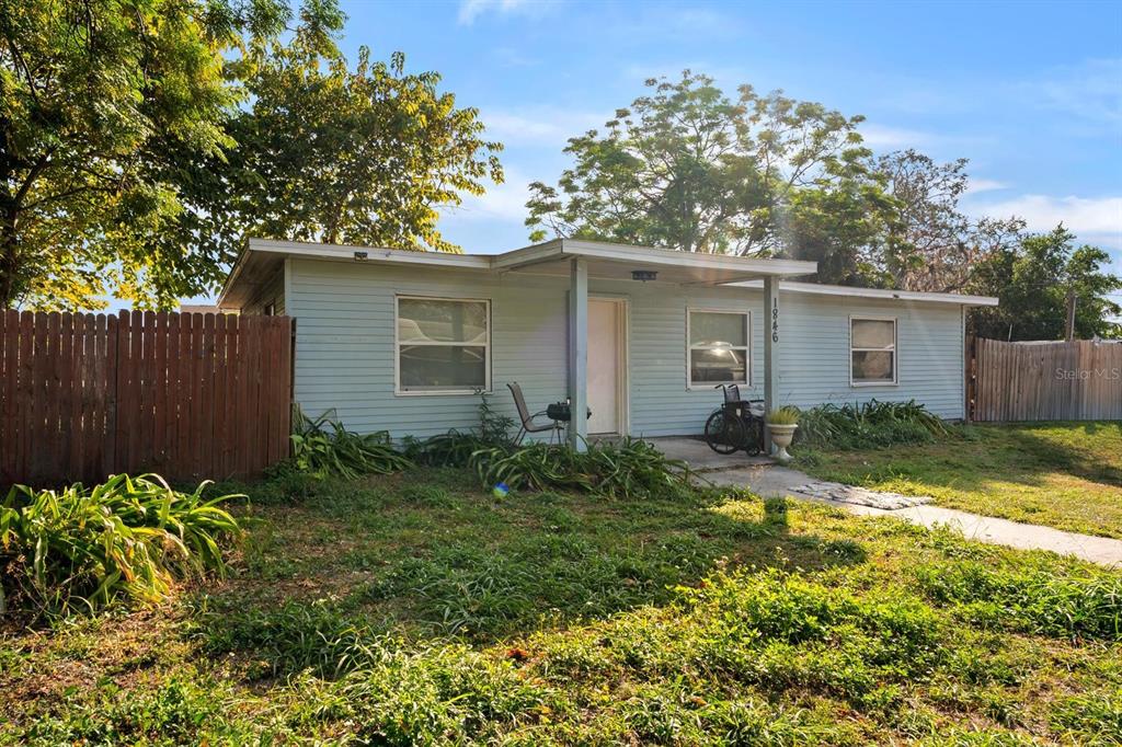1846 Abacus Road Holiday, FL 34690 - Photo 2 of 20 a view of a backyard with plants and large trees