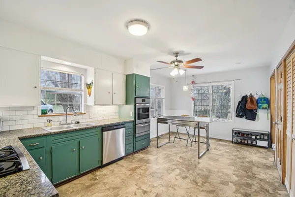 a kitchen with a sink and cabinets