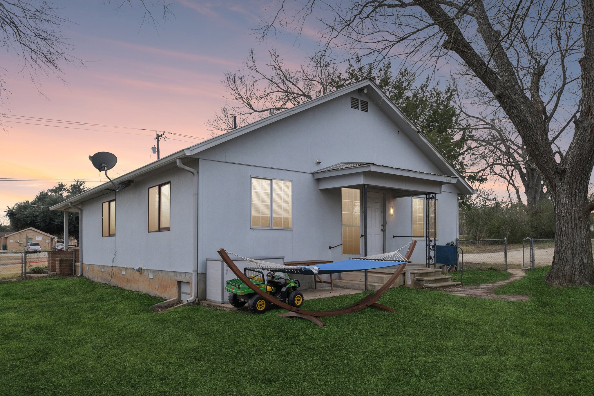 528 Old McDade Road Elgin, TX 78621 - Photo 2 of 30 Virtual twilight shot of back of home with virtual green grass