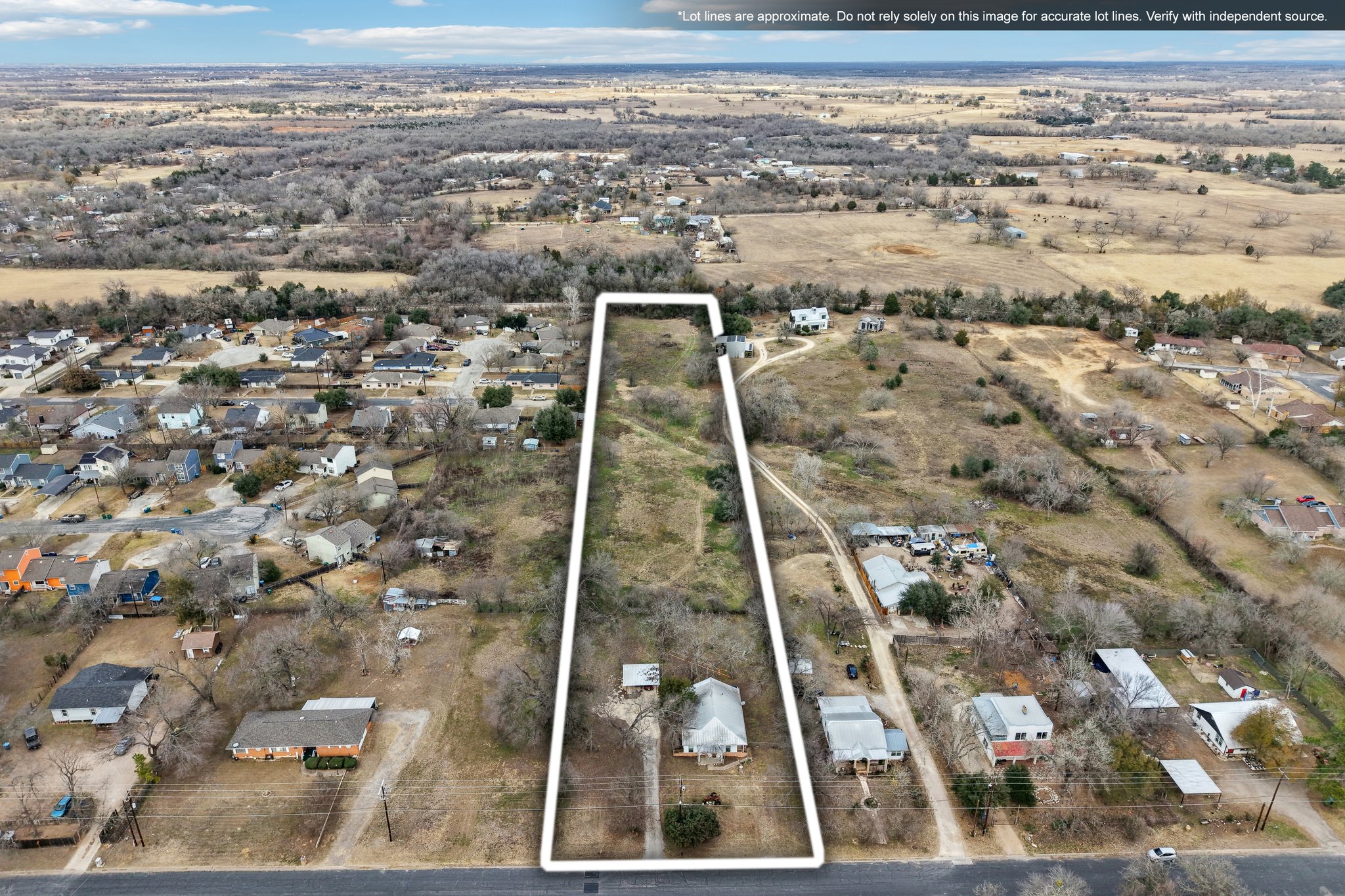 528 Old McDade Road Elgin, TX 78621 - Photo 28 of 30 Aerial overview of property's location with nearby suburban area and property parcel outlined