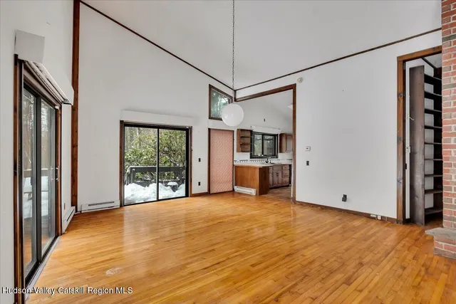 a view of a room with cabinet and windows