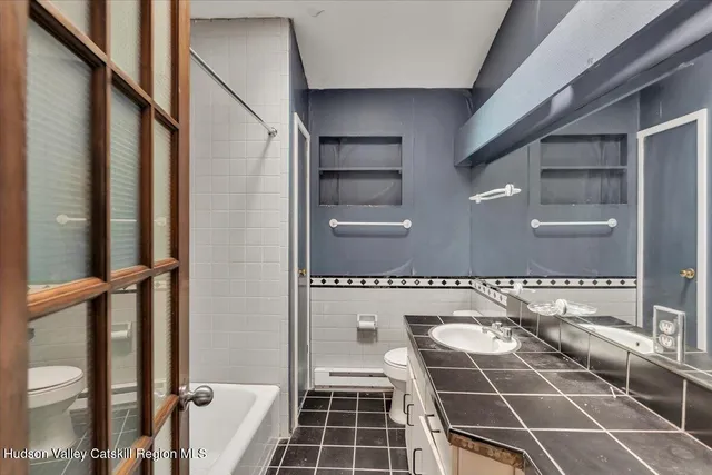 a picture of a bathroom with a sink and a mirror