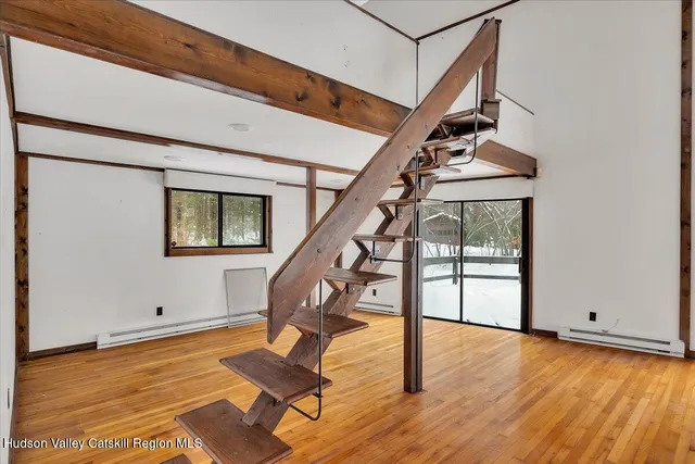 a view of entryway with wooden floor